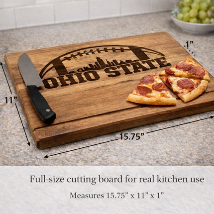 Ohio State football cutting board shown with size and scale measurements, displaying full dimensions of 15.75 by 11 by 1 inches on solid acacia wood
