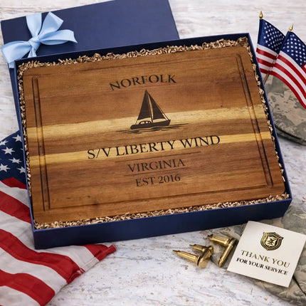 Norfolk sailboat cutting board presented in gift box with American flag and patriotic elements for military or navy gift