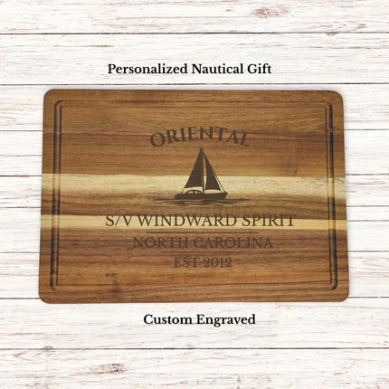 Personalized Oriental North Carolina sailboat cutting board engraved with boat name windward spirit and established year on acacia wood