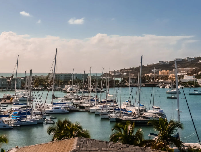 Marina and sailboats in Oyster Pond Harbor on Saint Martin featuring protected waters, yacht facilities, palm trees, and Caribbean cruising infrastructure