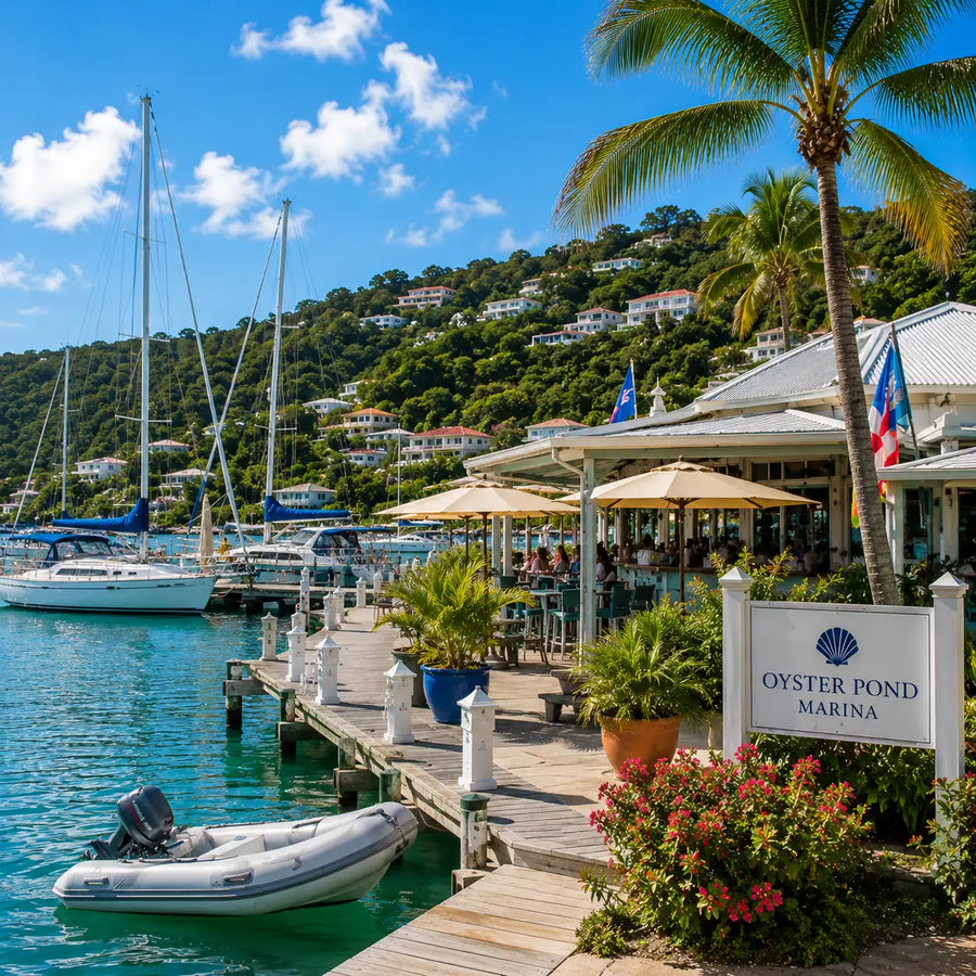 Waterfront marina village at Oyster Pond Harbor in Saint Martin featuring sailboats, marina docks, tropical landscaping, waterfront dining, and protected Caribbean waters