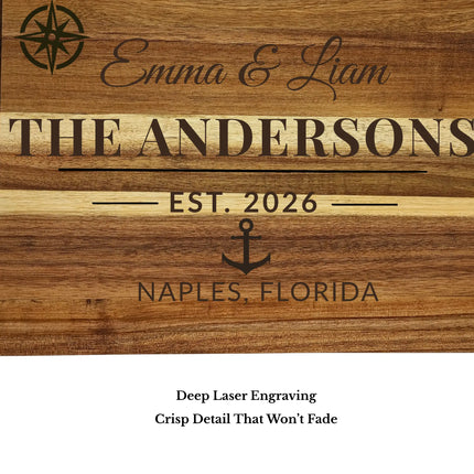 Close-up of engraved names and date on acacia wood cutting board showing deep laser engraving detail