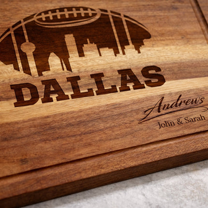 Close up of deep laser engraved Dallas football cutting board showing carved lettering and wood grain detail