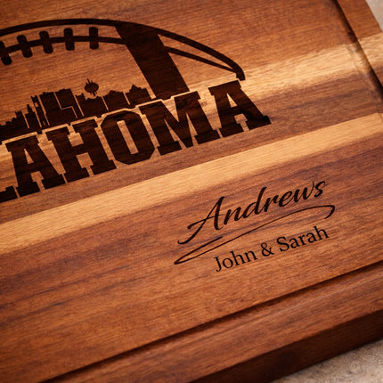 Close up of deep laser engraved Oklahoma football cutting board showing carved lettering and wood grain detail