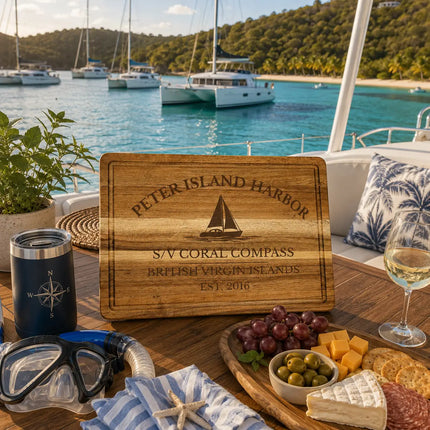 Peter Island Harbor British Virgin Islands sailboat cutting board displayed aboard a catamaran beside calm turquoise Caribbean anchorages lush tropical hillsides and secluded island scenery