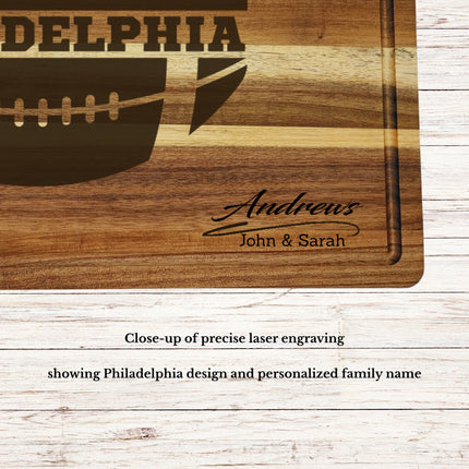Close up of Philadelphia football cutting board showing detailed skyline engraving and personalized name