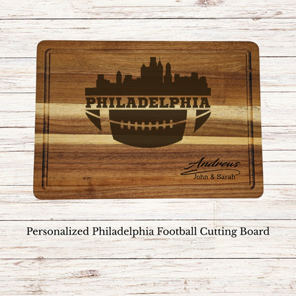 Personalized Philadelphia football cutting board engraved on acacia wood with city skyline and family name