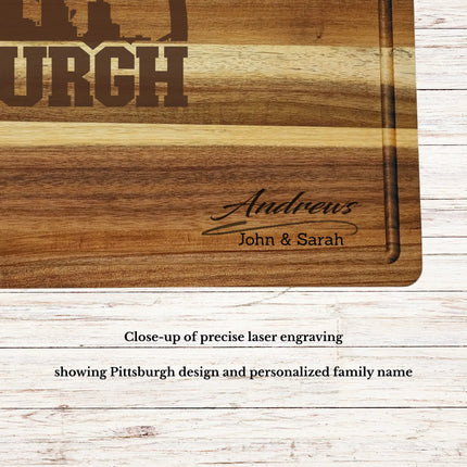 Close up of laser engraved Pittsburgh skyline baseball design on personalized acacia wood cutting board