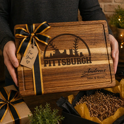 Personalized Pittsburgh baseball cutting board presented as a gift with black and gold ribbon and wrapped boxes