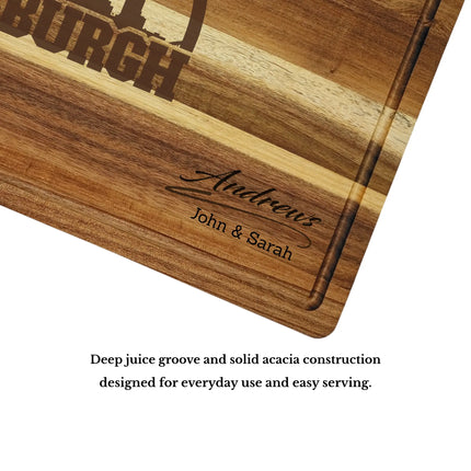 Acacia wood cutting board with deep juice groove and thick construction showing quality craftsmanship and durability