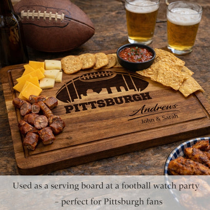 Personalized Pittsburgh football cutting board used as a serving board at a football watch party