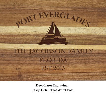 Close up of Port Everglades Florida sailboat cutting board engraving showing detailed sailboat design and acacia wood grain