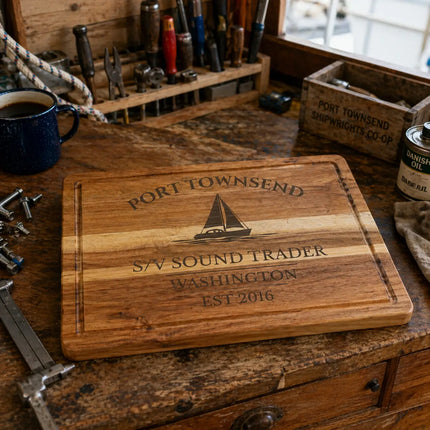 Port Townsend Washington sailboat cutting board on a working boat galley workbench with tools rope and practical setup