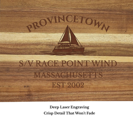 close up engraving detail Provincetown Massachusetts sailboat cutting board showing laser engraved sailboat and harbor name
