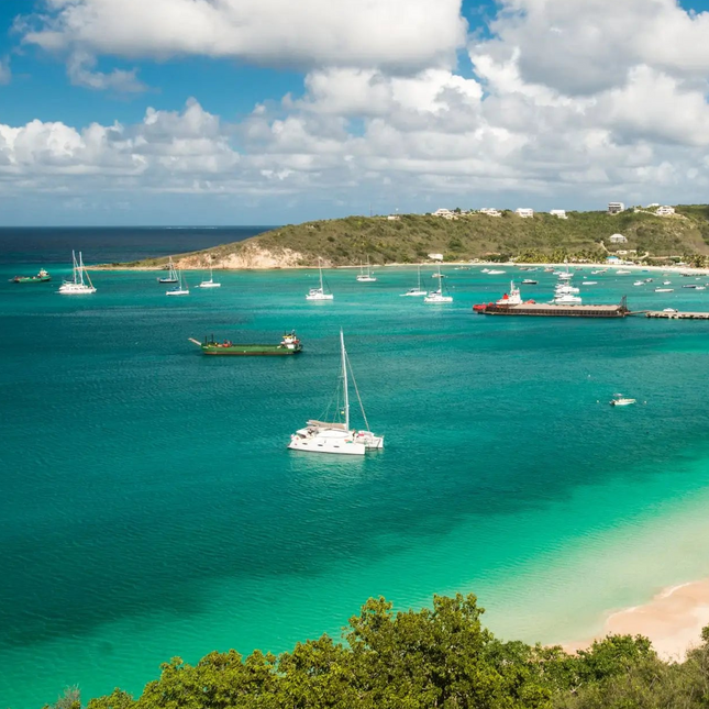 Turquoise waters with boats and a clear sky at Road Bay.