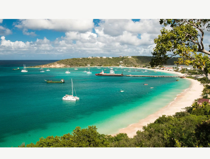 Anchored sailboats and turquoise waters in Road Bay Harbor, Anguilla, a popular Caribbean cruising destination and gateway to the Leeward Islands