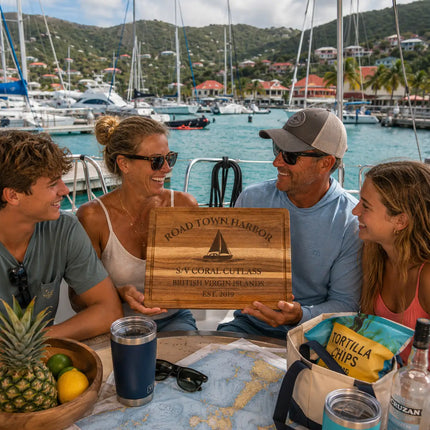 Road Town Harbor British Virgin Islands personalized cutting board being shared during a lively Caribbean charter sailing gathering beside catamarans and marina lights