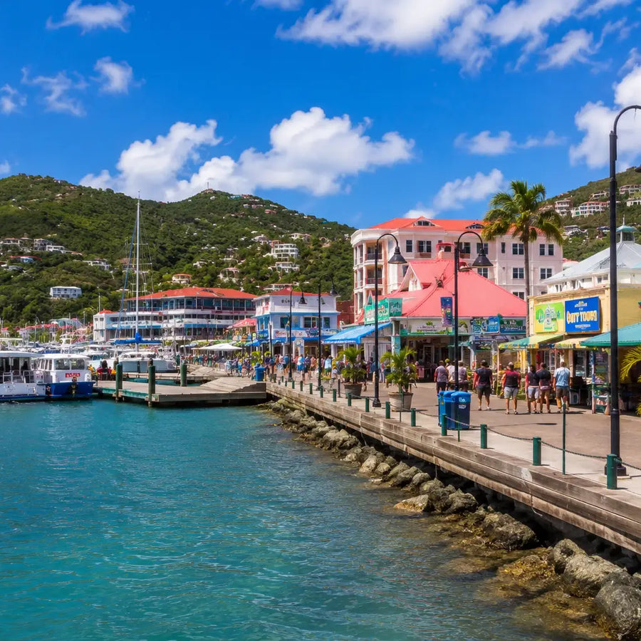 Elevated panoramic view of Road Town and Road Harbour with marinas, anchored yachts, waterfront buildings, and the surrounding hills of Tortola, British Virgin Islands.