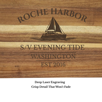 Close up of Roche Harbor Washington sailboat cutting board engraving showing detailed sailboat design and acacia wood grain