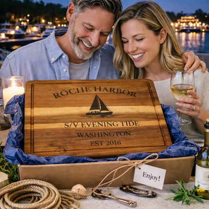 Roche Harbor Washington personalized cutting board being given as a nautical gift on the dock with marina setting