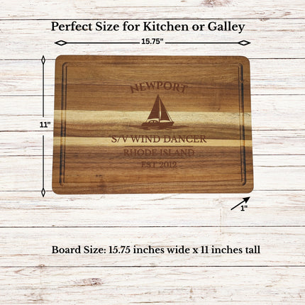 Size dimensions of personalized sailboat cutting board measuring 15.75 by 11 inches made from solid acacia wood