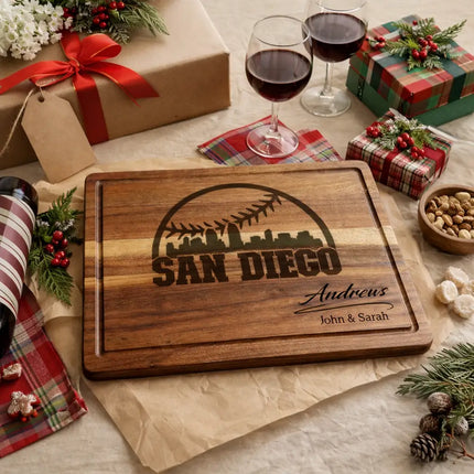 Personalized San Diego baseball cutting board presented as a gift with wrapped boxes ribbon and decorative elements
