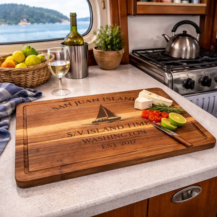 San Juan Islands Washington sailboat cutting board used in a boat galley with fresh ingredients while anchored in calm island waters