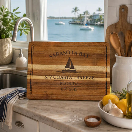 Sarasota Bay Florida sailboat cutting board in a coastal kitchen with bay view natural light and relaxed Gulf Coast setting