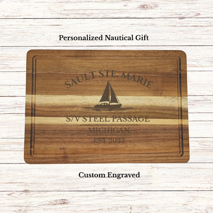 Personalized Sault Ste Marie Michigan sailboat cutting board engraved with boat name and home port on acacia wood