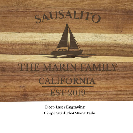 Close up of Sausalito California sailboat cutting board engraving showing detailed laser etched design and acacia wood grain