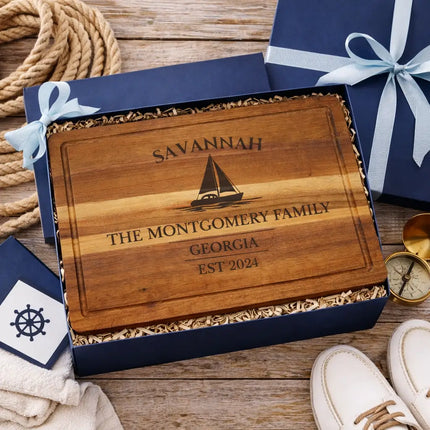 Savannah sailboat cutting board presented in nautical themed gift box with rope compass and coastal decor