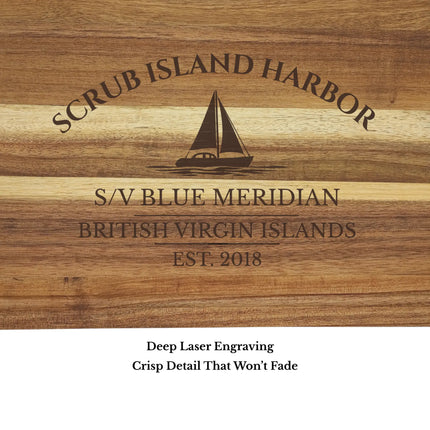 Close up of Scrub Island Harbor British Virgin Islands sailboat cutting board engraving showing detailed sailboat design and clean acacia wood grain