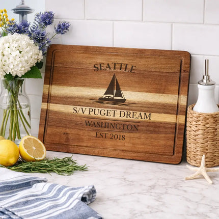 Seattle Washington sailboat cutting board displayed in coastal kitchen with fresh ingredients and nautical decor