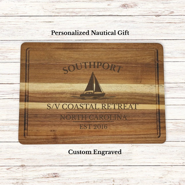 Personalized Southport North Carolina sailboat cutting board engraved with boat name coastal retreat and established year on acacia wood