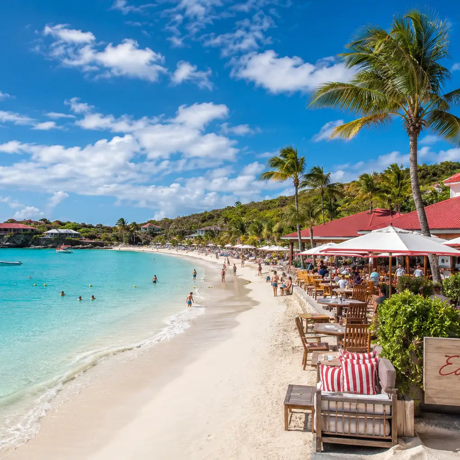 Beachfront dining, white sand beaches, and turquoise Caribbean waters at St. Jean Bay in St. Barths.