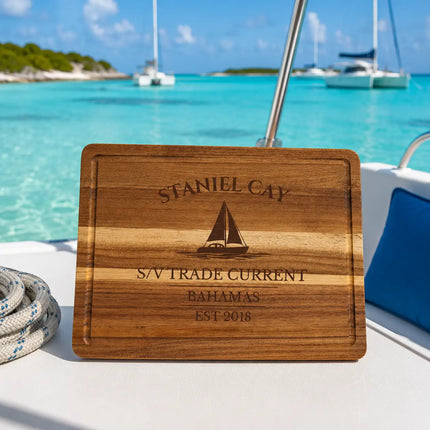 Staniel Cay Bahamas sailboat cutting board on a catamaran overlooking shallow turquoise Exumas water and tropical sandbars