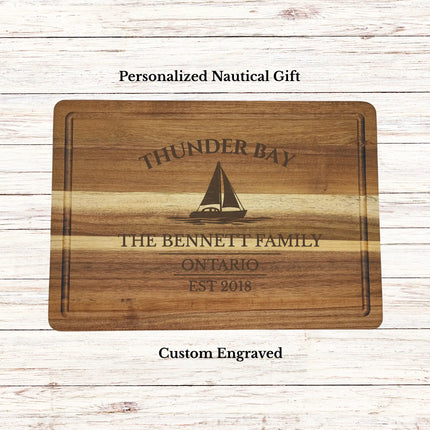 Personalized Thunder Bay Ontario sailboat cutting board engraved with boat name and established date on premium acacia wood nautical gift