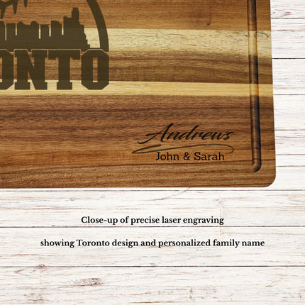 Close up of laser engraved Toronto skyline baseball design on personalized acacia wood cutting board