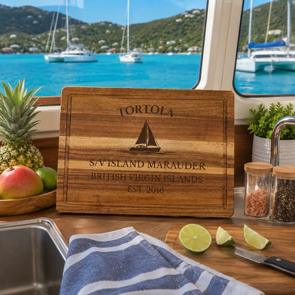 Tortola British Virgin Islands sailboat cutting board displayed beside turquoise Caribbean bays catamarans tropical hillsides and BVI sailing scenery