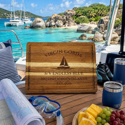 Virgin Gorda British Virgin Islands sailboat cutting board displayed beside turquoise Caribbean anchorages dramatic granite boulders catamarans and tropical island scenery