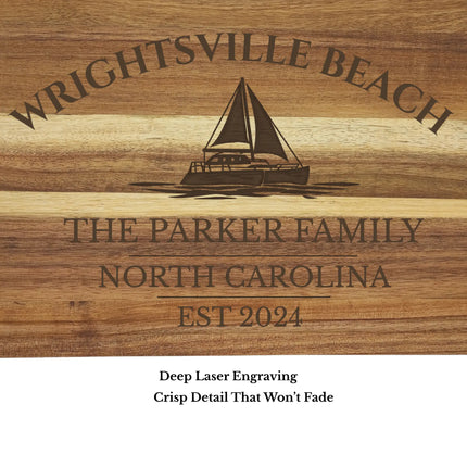 Close up of Wrightsville Beach sailboat engraving on acacia wood cutting board showing detailed laser engraving quality